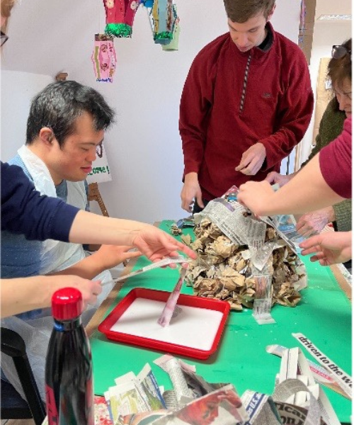 James Place Basingstoke member creating a papier mache volcano