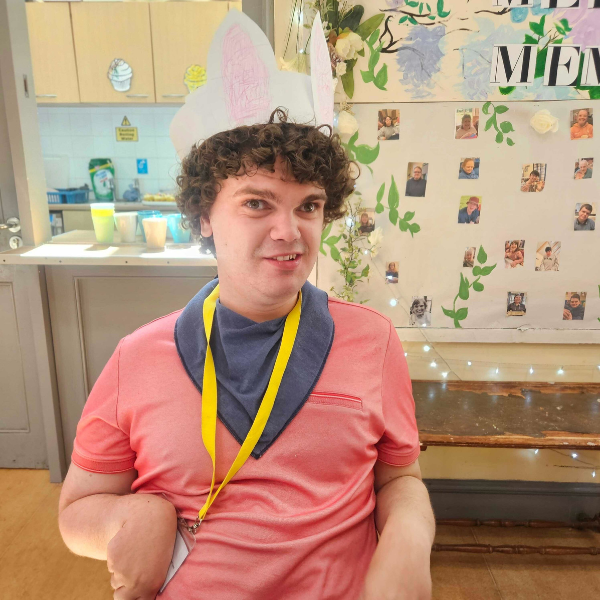 Male JP Basingstoke member in pink top showing off his bunny ears in the spirit of easter