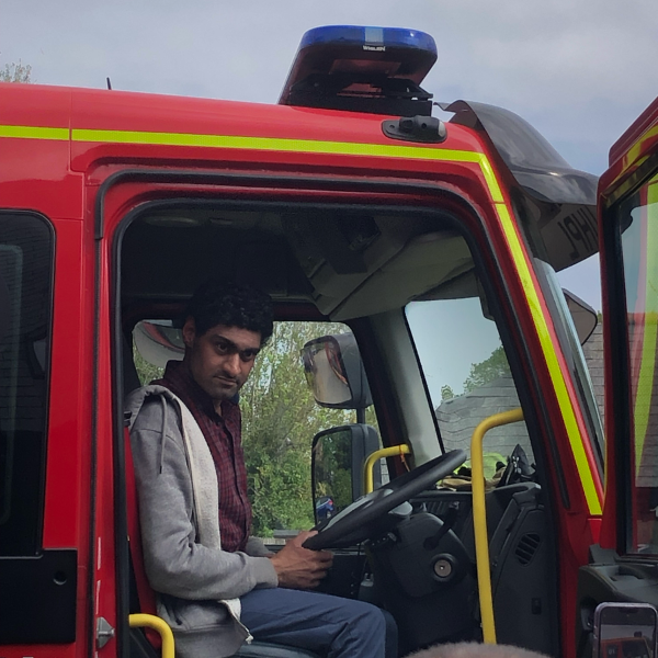 male JP Basingstoke member behind the steering wheel of a fire engine