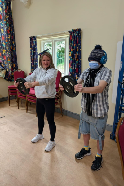 JP Andover members exercising with weights