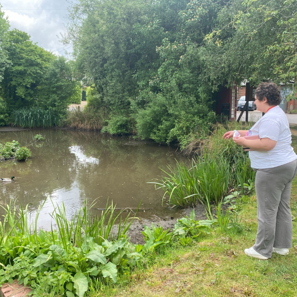 jp member gazing in to a lake