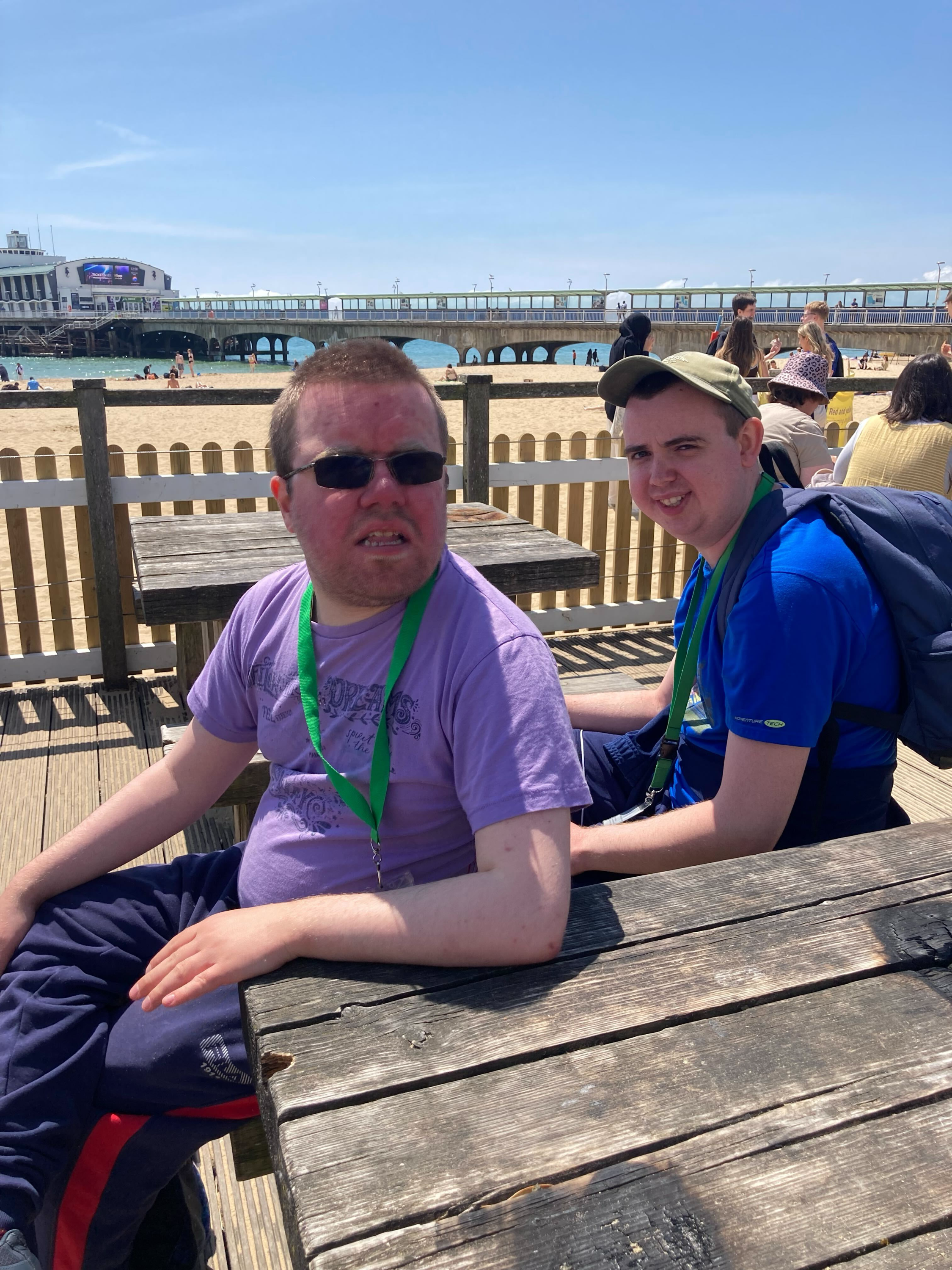 sitting on a bench near the beach