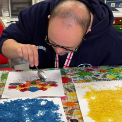 using a spoon to paint 