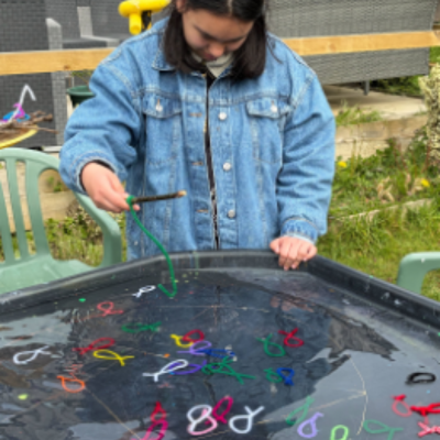 An Eastleigh member doing a spot of fishing in the garden at James' Place Adult Daycare Eastleigh