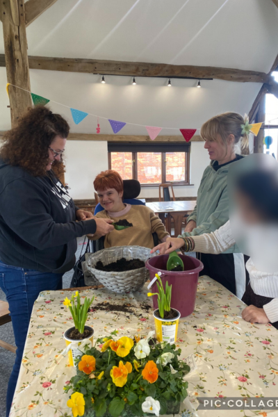 James' Place Adult Daycare Reading West members planting colourful plants and flowers for spring
