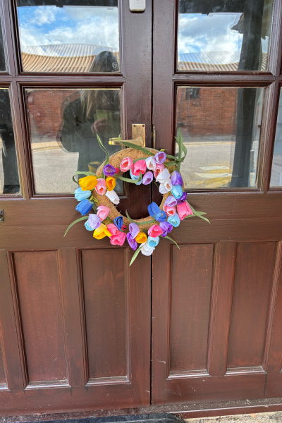 a colourful door wreath