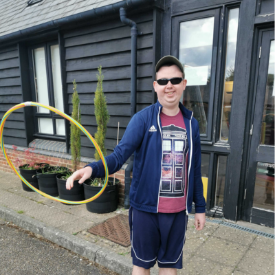 outside having fun hula hoop
