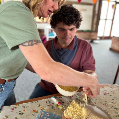 making grated cheese sandwhich