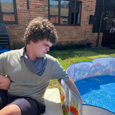 hand dipped in paddling pool